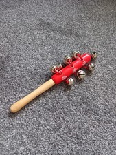 HAND-HELD JINGLE STICK MUSICAL INSTRUMENT