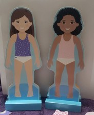2 WOODEN MAGNETIC DOLLS WITH STAND. CLOTHES AND ACCESSORIES