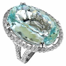 27.41 Carat Oval Cut Aquamarine Center Stone  1.35 Carat White CZ Wedding Ring
