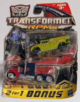 2009 TRANSFORMERS RPMs 2-for-1 Trucks Optimus Prime & Ratchet Damaged Packaging