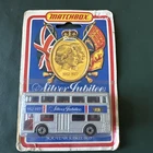 1977 LESNEY MATCHBOX SILVER JUBILEE MATCHBOX SOUVENIR DOUBLE BUS SILVER ON CARD