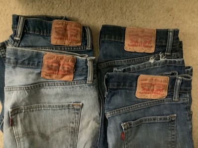 Four pairs of Levis jeans 32-30, 501, 514, distressed