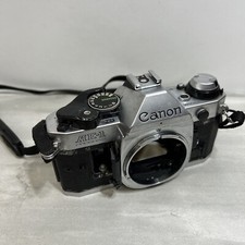 Canon AE-1 program silver body only. With strap - For Parts Only