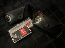 Two Black Ray Ban Cases With Red Lining, Booklet And Cleaning Cloth