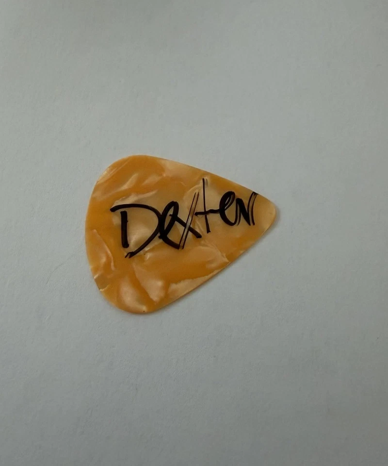 The Offspring Autographed Signed Guitar Pick - Dexter - Image 1 of 1