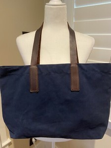 blue bag brown straps