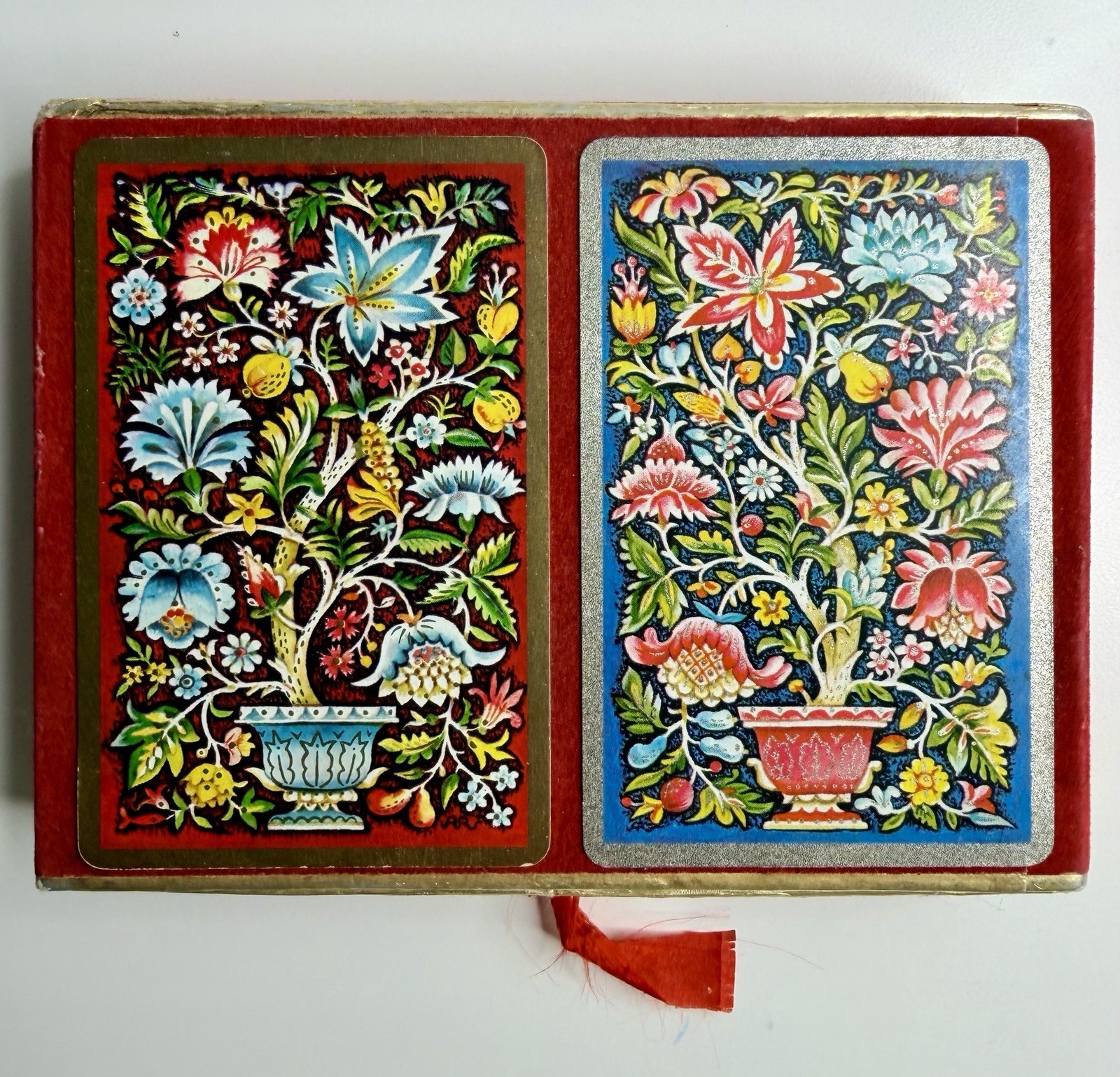 A velvet bridge case holding two decks of Congress playing cards.