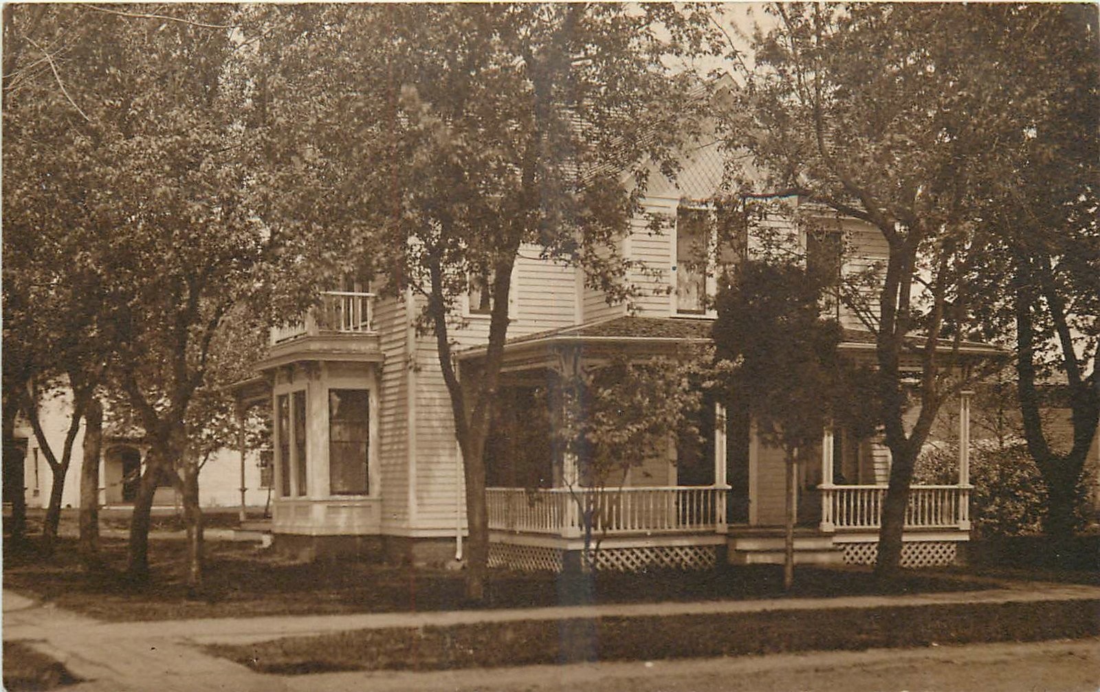 c1910 Menomonie Wisconsin 803 Main Street RPPC Postcard 25-9483