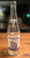 9 5/8” VIKING ACL SODA BOTTLE 12 OZ SOUTH ST PAUL MINN MN PICTURE LABEL. PURPLE