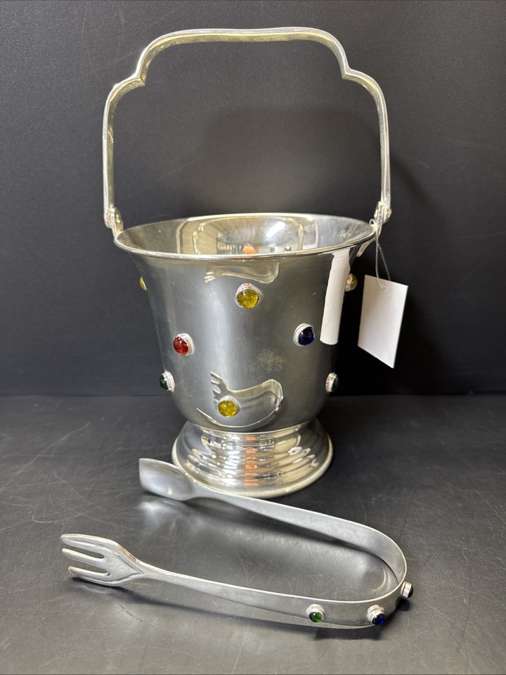 Chrome ice bucket encrusted with jewels — looks like something from a Vegas lounge circa 1965.