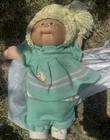 Vintage 1980s cabbage patch Play Doll Green knitted dress wool hair