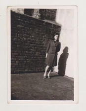 Beautiful Young Lady Woman Radiates Joy Casting a Playful Shadow on the Wall