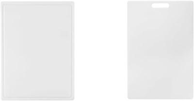 Reversible polyethylene cutting board with juice trough and easy to grip handle,