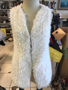 white fuzzy vest