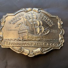 Belt Buckle - Livingston Wells Co Foreign Domestic Gold Dealers Silvertone