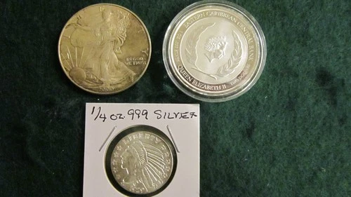 2.25 oz.  Silver bullion rounds (one is a 2000 Silver Eagle)