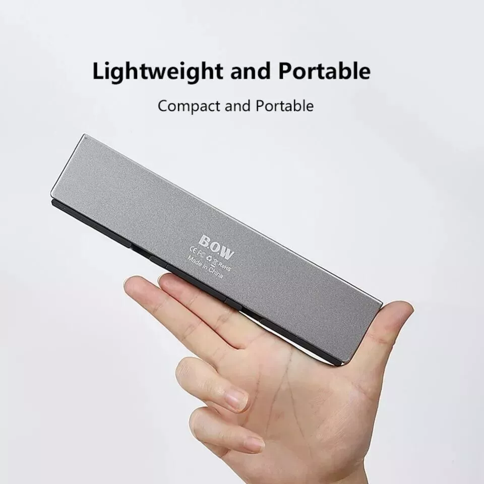 Mini Teclado Bluetooth Plegable para Android/Windows/IOS con Estuche de Peluche Foto 4 de 4