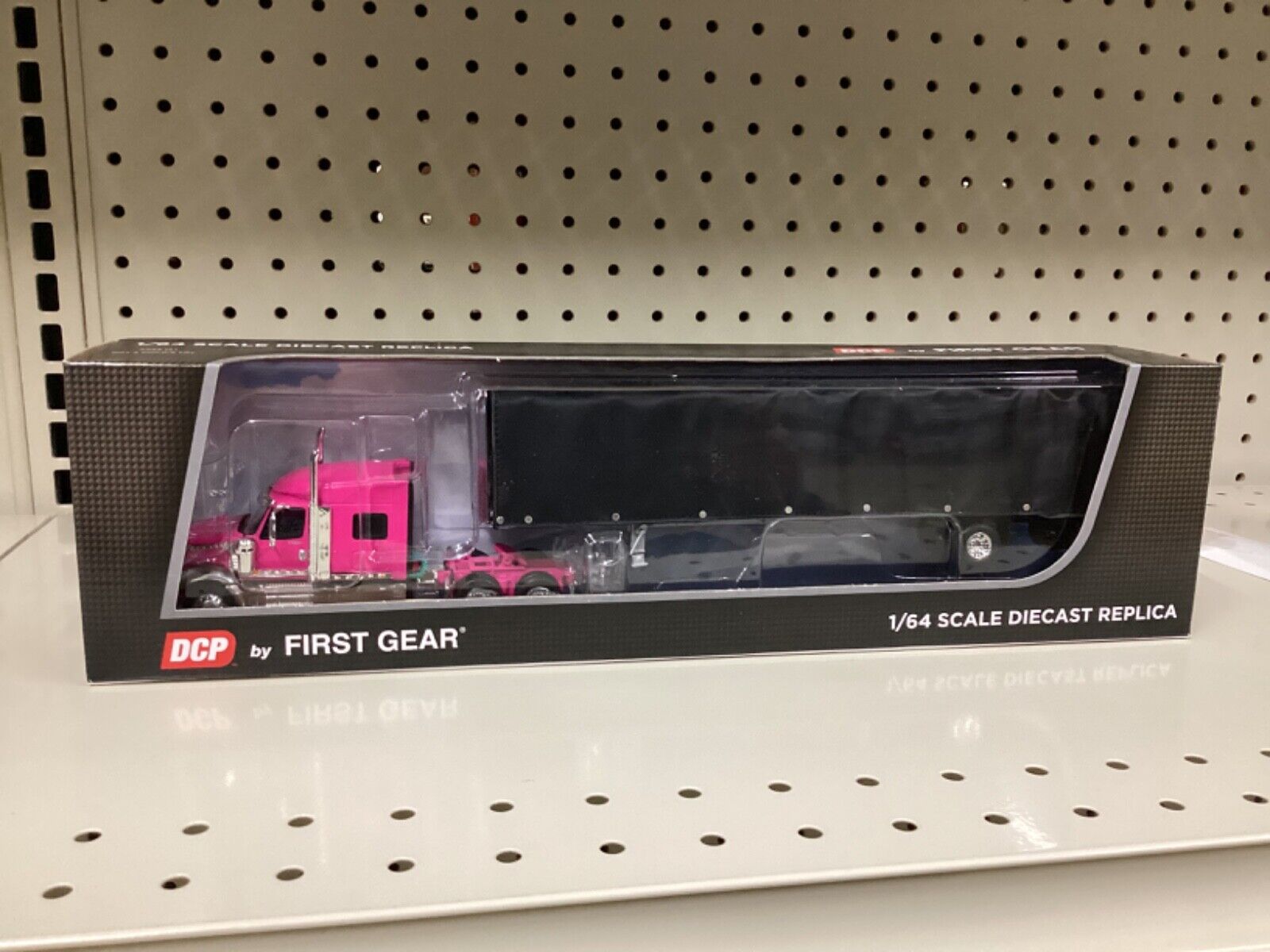 1:64 DCP by First Gear, pink International Lonestar with utility trailer