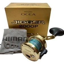 Used SHIMANO Bait reel Ocean Jigger 2000P RH302 with scratches and dirt