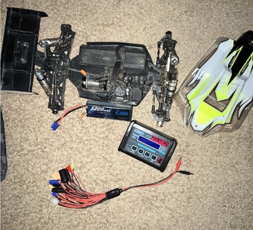 RC race E buggy comes with a charger, battery it’s neon yellow and white