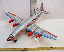 AMERICAN AIRLINES LOCKHEED L-188 ELECTRA II 4 ENGINE AIRPLANE BATTERY TIN TOY
