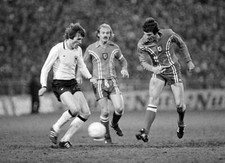 John Toshack of Wales is challenged by Manfred Kaltz of West Germa- Old Photo