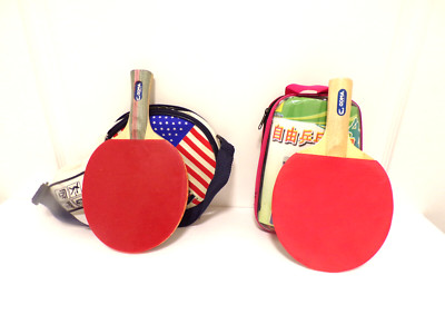 Two double layer table tennis rackets  in a case with net for play
