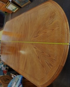 dining table est. 7' incl. a 1.5' leaf x 3.5' wide x 2.5' high oval wood used