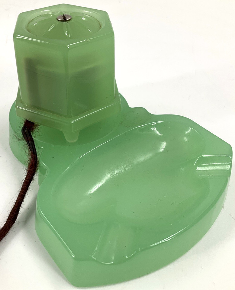 A working Art Deco jade green glass table lighter — functional sculpture that doubles as a jaw-dropping desk centerpiece.