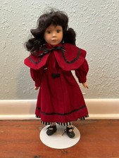 16" Limited Collection vintage porcelain doll with red dress  curly brown hair