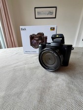 Black digital camera with 8k ultra hd, auto focus and anti shake.  Barely used! 