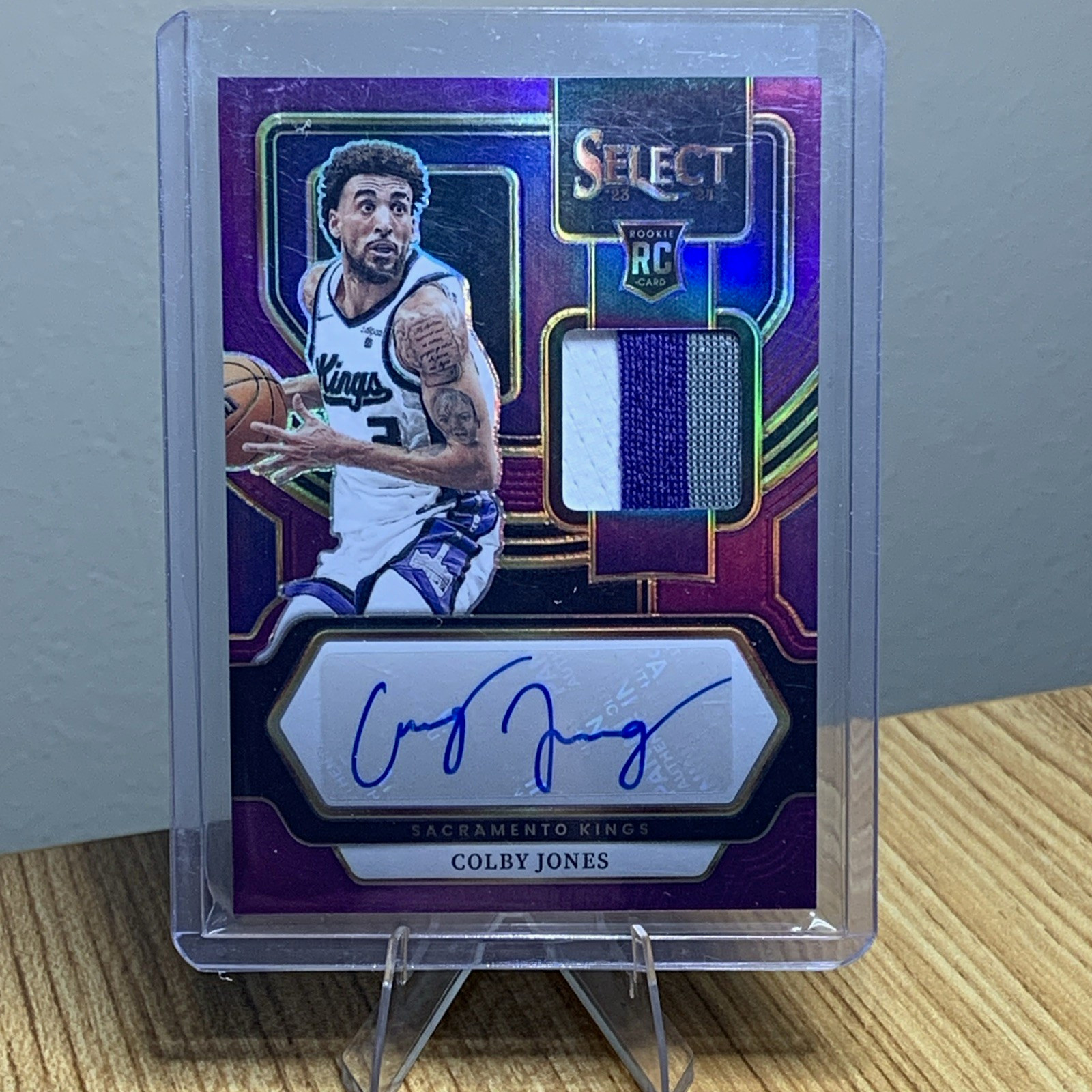 Panini Select 2023-24 Colby Jones RC Auto Jersey Purple Prizm /99 #RJ-JNE