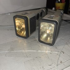 2 Emergency Flash Lights Am/FM Radio With Siren W/batteries Sold As Is