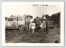 1930s Black  White Of A Family Driving 1933 or 1934 Ford Pulling Trailer