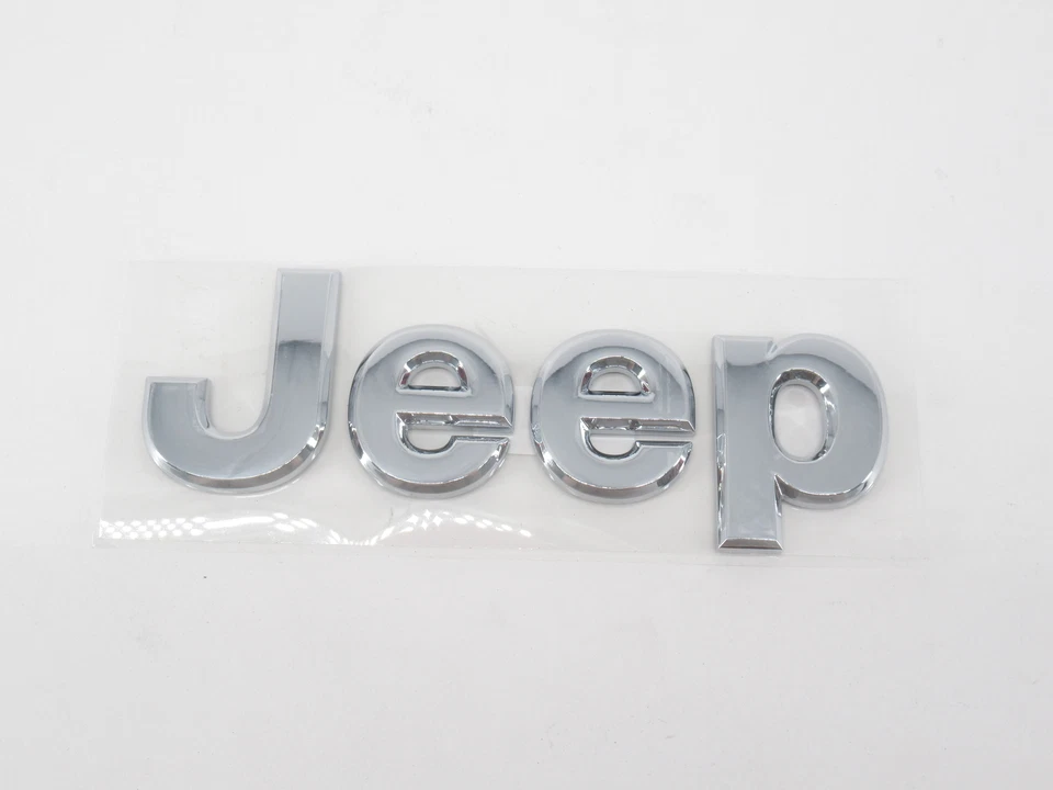Placa de identificación genuina OEM Mopar Jeep 68364626AA "Jeep" parrilla delantera emblema insignia Foto 2 de 3