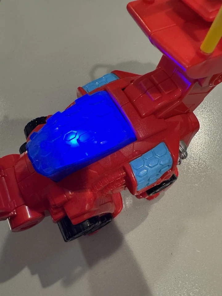 Figura de acción Transformers Rescue Bots Heatwave Playskool Dino Bot funciona Foto 2 de 4