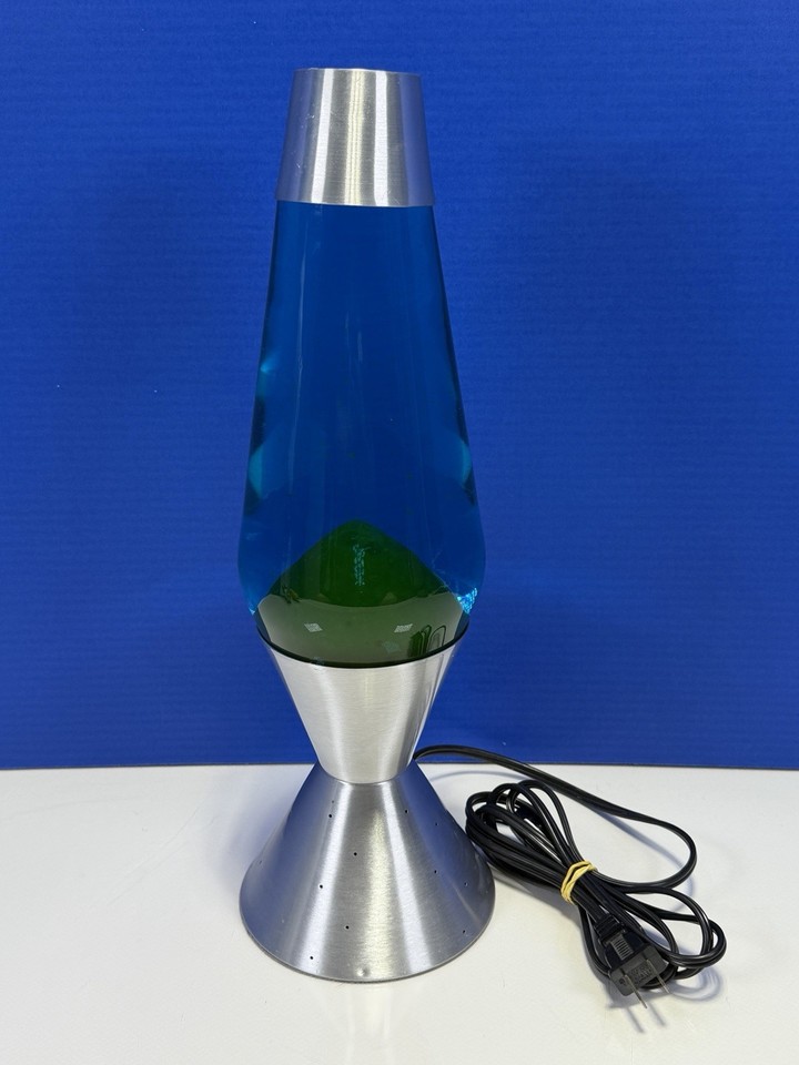 A genuine late-90s Lava Lite with a sleek silver Starlite base — the OG ambient mood lamp that never goes out of style.
