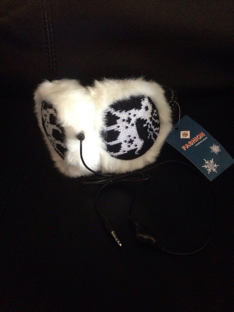 Plush Faux Fur Earmuffs Encasing Beige Headphones for Cozy Winter Listening on a Clear PNG or