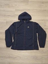 Vintage Adidas navy windbreaker jacket with gold stripes and embroidered logo.