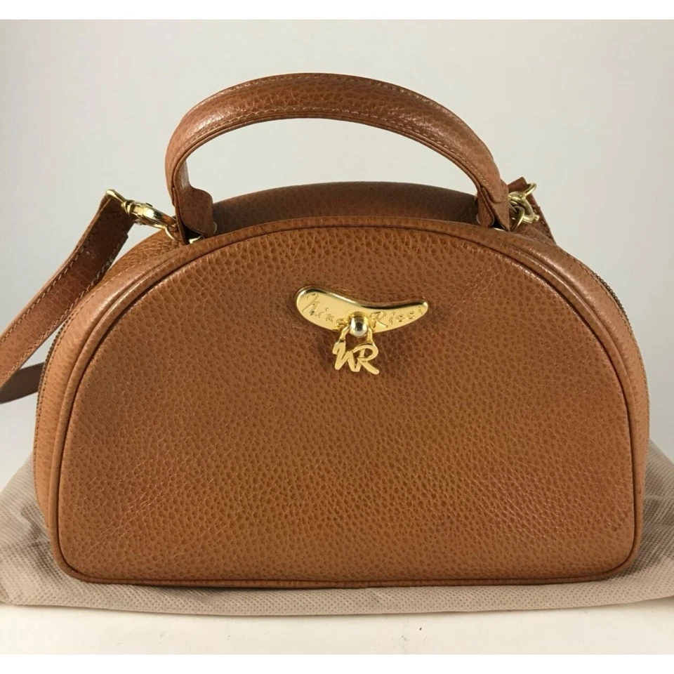 Bolso de hombro vintage de cuero tostado Nina Ricci con cubierta antipolvo Foto 2 de 4