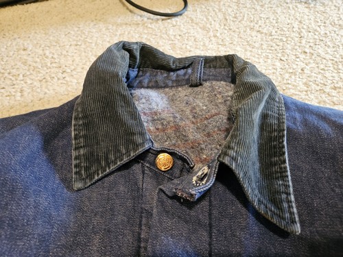 Wrangler Casey Jones vintage denim jacket with black corduroy collar, front snap buttons, and visible stitching on inner collar.