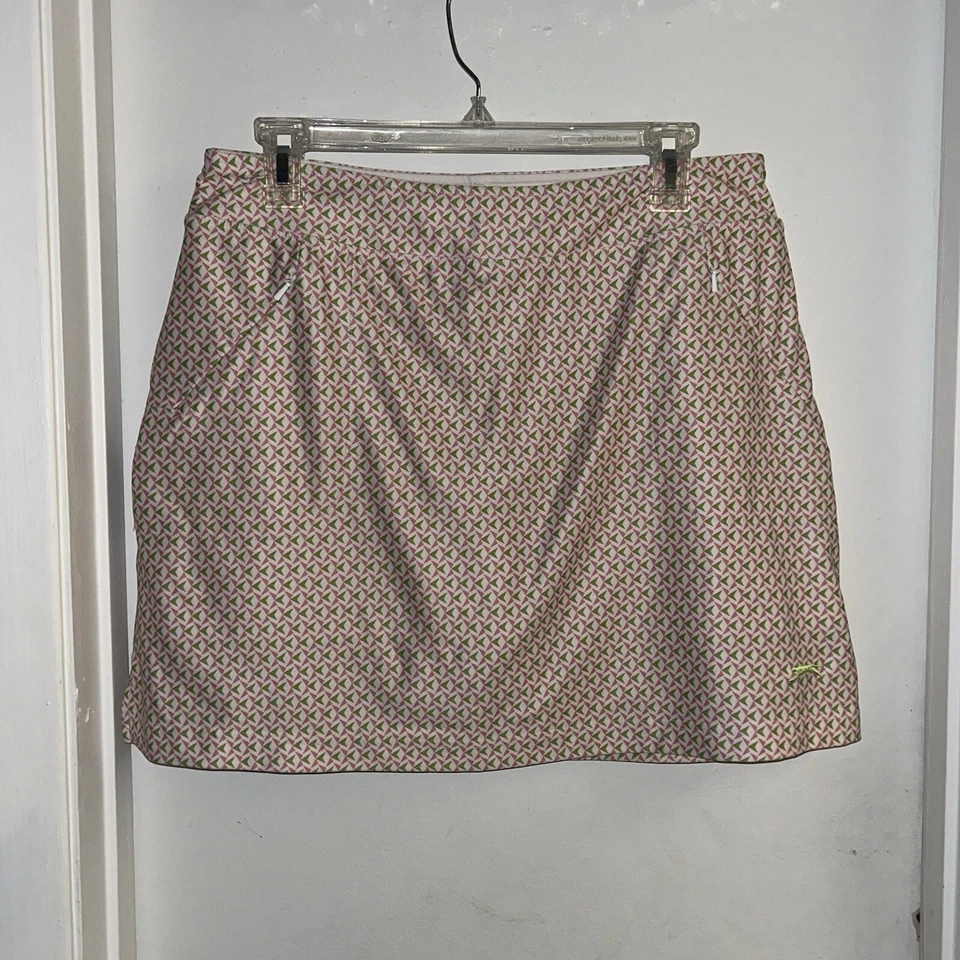 Falda corta Slazenger blanca y rosa geométrica de golf con bolsillos para mujer talla mediana Foto 2 de 4