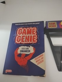 Nintendo NES Game Genie Game Enhancer Model 7356 w/ Cheat Codes Manual 
