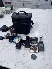 Canon AV-1 SLR  Camera With Flash, Zoom and Telephoto Lenses W Carry Case