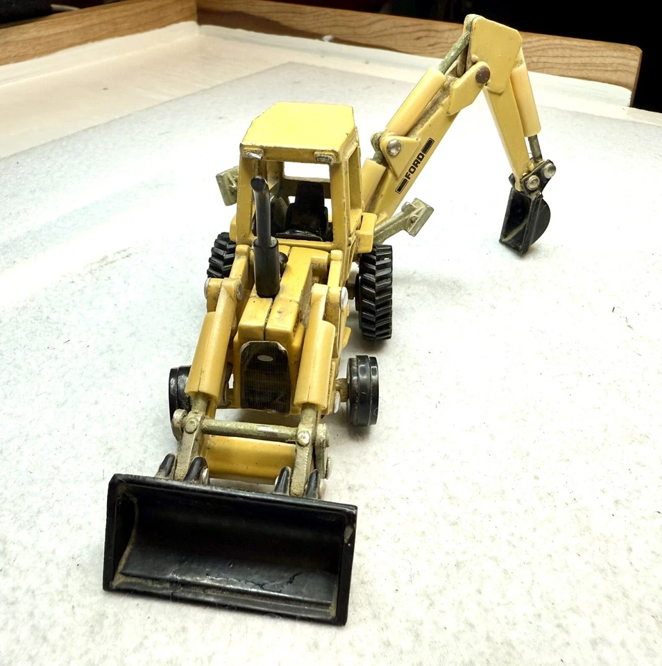 Tractor cargadora y retroexcavadora Ford ERTL 555B escala 1:64 buen estado vintage Foto 4 de 4