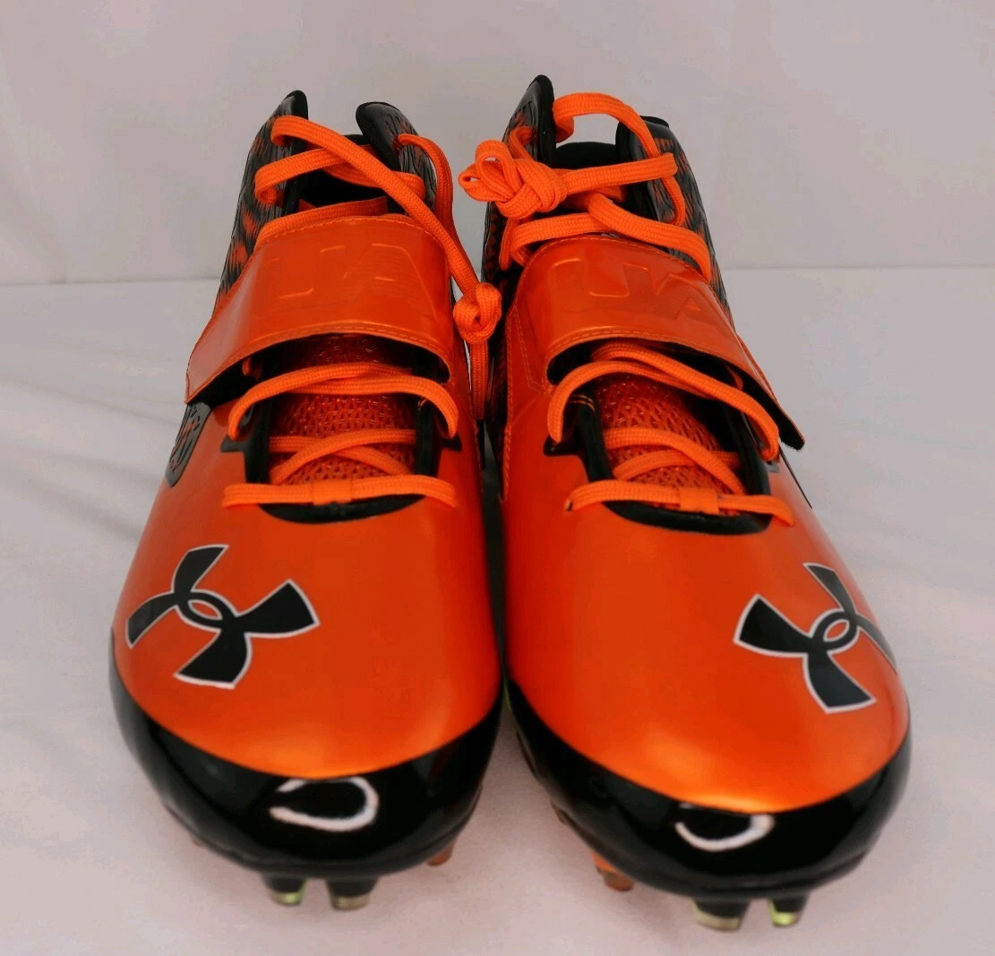 Orange and black under armour football cleats deals