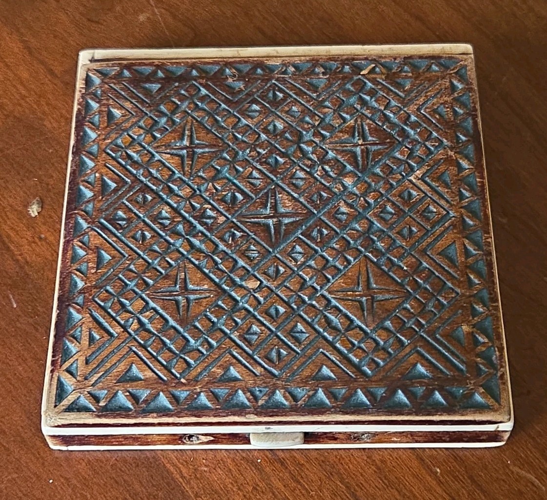 Antique 19th-century chip-carved wooden box with burl wood hinged lid.