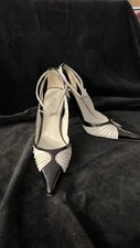 Black and white Baker brand pumps with ankle strap Size 7