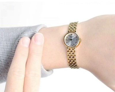 TISSOT DAMENUHR SCHÖNES QUARZ STAHL GELBGOLD ARMBAND & SILBERNES ZIFFERBLATT ORIGINAL