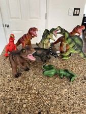 Assortment of toy plastic dinosaurs for budding paleontologists used as shown